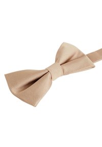 Beige szatén masni, textúrált, bordázott felülettel és középen kötött csomóval. Az állítható pánt a masni mögött látható.