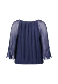 Dunkelbluse in Marineblau mit transparenten, ausladenden Ärmeln und gerafftem Ausschnitt. Glattes, leichtes Material mit fließendem Schnitt und minimaler Detailverarbeitung.