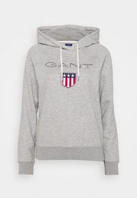 Sudadera gris con capucha hecha de mezcla de algodón, con logo en el frente, puños y dobladillo acanalados, cordones blancos y un ajuste casual.