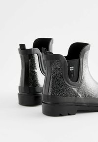 Next Stivali di gomma - black glitter