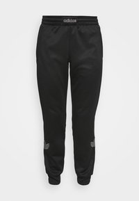 Černé tepláky z hladkého materiálu, vybavené elastickým pasem, bočními kapsami a malými vyšívanými detaily poblíž spodního lemu.