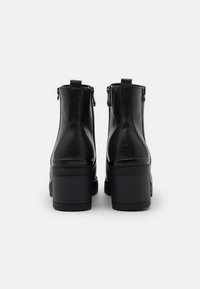 Marco Tozzi BOOTS - Platform ankle boots - black