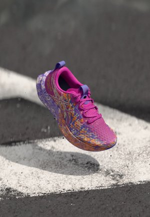 Purple and pink running shoe with a textured mesh upper and abstract orange pattern. Features laces, heel tab, and sturdy sole design.