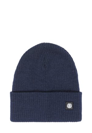 Navy blue knit beanie with a ribbed texture, folded cuff, and a small black logo patch on the front. Classic round shape.