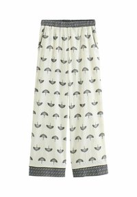 Cremfarbene weit geschnittene Hosen mit schwarzem Vogelprint, ausgestattet mit einem elastischen Bund in schwarz-weißem Muster und passenden Saumabschlüssen.