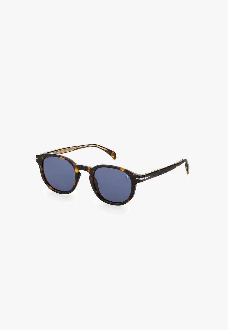 Occhiali da sole tartaruga con lenti rotonde, tonalità blu scuro e eleganti dettagli neri sulle astine. Finitura lucida, design leggero.
