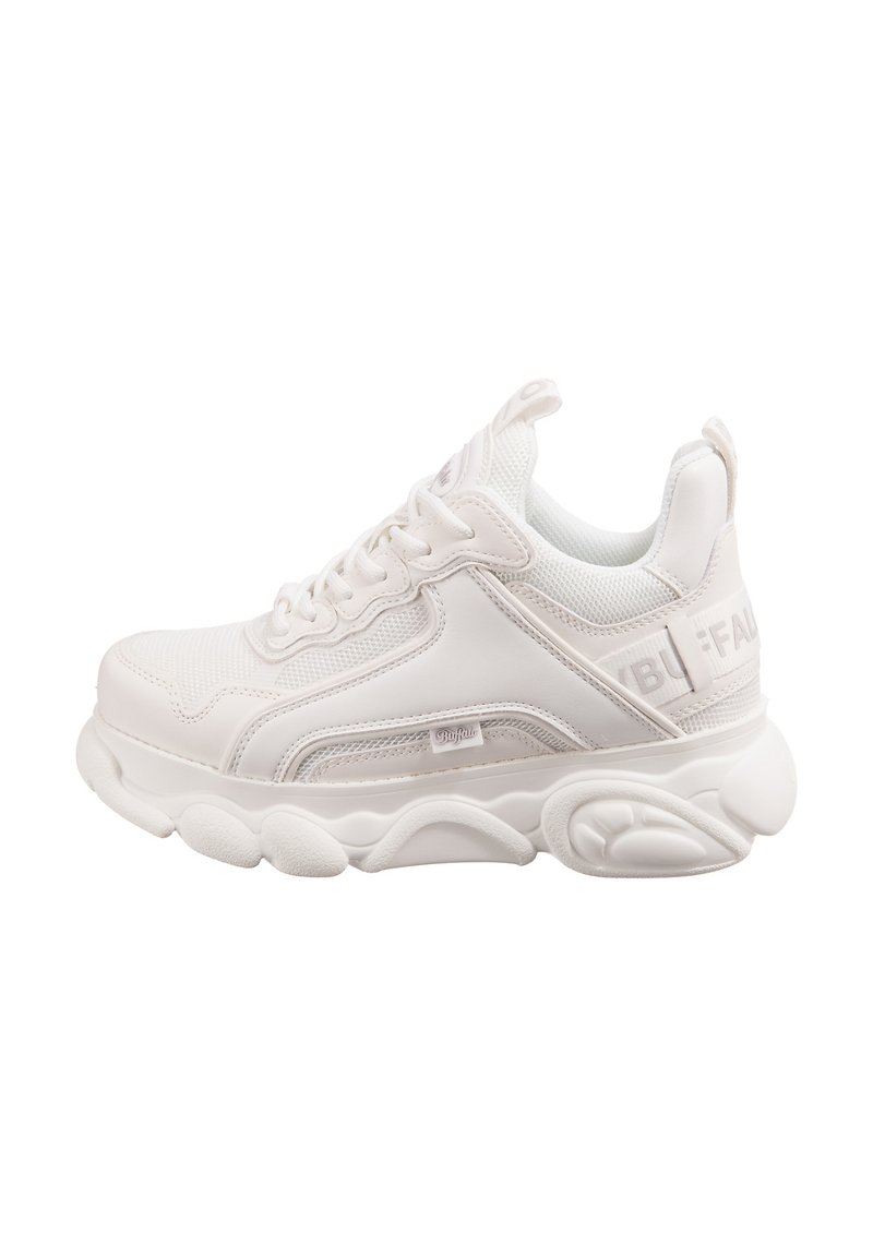 White athletic shoe featuring a textured mesh upper, padded tongue, and chunky sole with distinct curves. Subtle branding on the side.