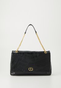 Black leather handbag with a crinkled texture, chevron pattern, gold chain strap, and a logo accent on the front. Rectangular shape.