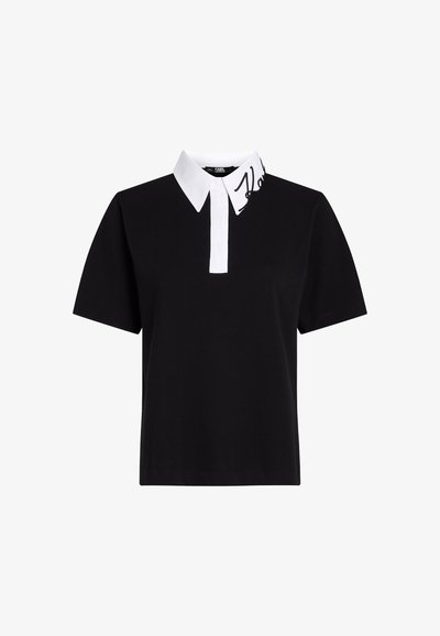 Черен поло блуза с къс ръкав, бял якичка с бродиран черен логотип и прав дизайн. Изработена от памук.