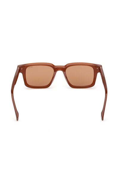 Brown square sunglasses with tinted lenses and glossy plastic frames. Thin arms connected at the temples, featuring no visible branding.