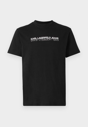 Čierne bavlnené tričko s okrúhlym výstrihom a krátkymi rukávmi. Na prednej strane sa nachádza obrátený biely text: "KARL LAGERFELD JEANS."