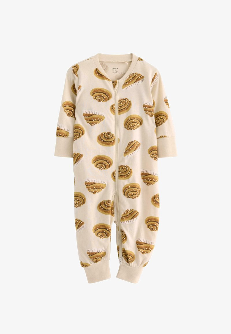 Une combinaison pour enfants de couleur crème avec un motif de roux à la cannelle, dotée d'une fermeture éclair et de manches longues. Fabriquée en tissu doux.