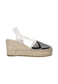 Sandalo espadrille con zeppa, suola in juta intrecciata, tomaia in tessuto a fantasia geometrica bianca e nera e cinturino alla caviglia in elastico bianco.