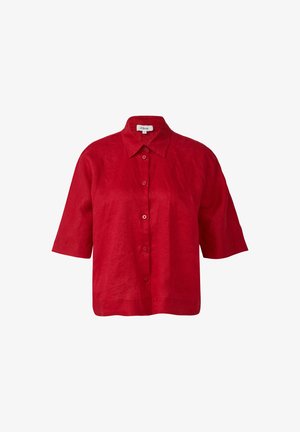 Punane lina särg krae kaelusega, lühikeste varrukatega ja nööpidega esiküljel. Omab lõdva istuvust ja peent tekstuuri.