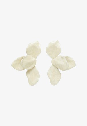 Asymmetrical white floral-shaped earrings with overlapping petal-like components, showcasing a subtle pearlescent texture.