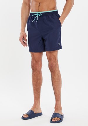 Marine zwemshorts met een trekkoord in de taille en lichtblauwe accenten. Voorzien van zijzakken en een logo op de linkerdij.