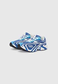 Blue and white athletic shoes with a textured mesh upper, padded tongue, and wavy design accents. Black rubber sole with traction patterns.