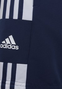 Navy blue athletic jersey with white horizontal stripes, featuring an Adidas logo in white. Smooth fabric with subtle texture.