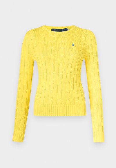 Dzeltena adīta džempera ar garām piedurknēm, apaļu kakla izgriezumu un ribots apakšējais malas. Uz krūtīm neliela zila logo.