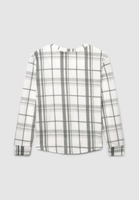 Camicia a maniche lunghe realizzata in tessuto morbido, con un motivo a quadri grigio e bianco, scollatura rotonda e orlo dritto.