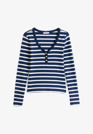 Hosszú ujjú tengerészkék és fehér csíkos felső V-kivágással, elöl három arany gombbal és fitted fazonnal. Pamut keverékből készült.