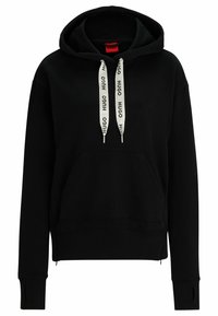 Černá mikina s kapucí a přední kapsou typu kangaroo, bílé šňůrky s potiskem "HUGO," zúžené rukávy s otvory na palce a červená vnitřní visačka.