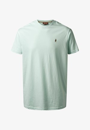 Vaalean mintunvihreä puuvillapaita lyhyillä hihoilla, pyöreällä kaula-aukolla ja pienellä ruskealla logolla vasemmassa rinnan kohdalla. Silkkinen rakenne.