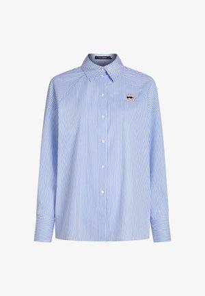 Light blue and white vertical striped long-sleeve shirt with button front and small embroidered face with sunglasses on left chest.