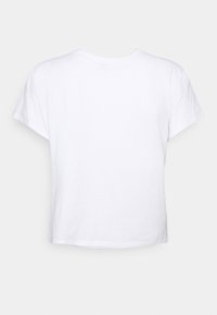 Vit kortärmad t-shirt gjord av bomull, med rund halsringning och avslappnad passform, med en mjuk textur och utan synliga mönster.