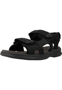 Sandalia negra con correas ajustables, diseño de punta abierta, plantilla acolchada y suela de goma texturizada con orificios de ventilación.