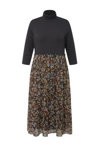 Długa sukienka z czarną, prążkowaną bluzką typu golfowego i warstwową spódnicą w kwiatowy wzór w ciemnych odcieniach z wielokolorowymi kwiatami.