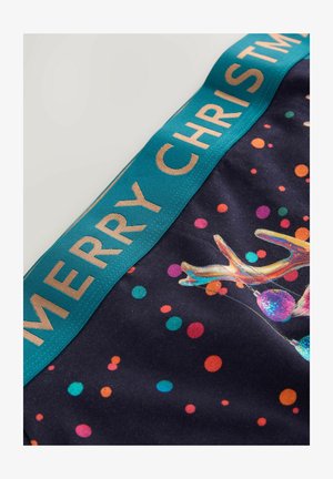 Jule-novelty boxershorts med en mørk baggrund, der har livlige polkaprikker og et rensdyrmotiv, fremhævet med en taljebånd med teksten "GLÆDELIG JUL".