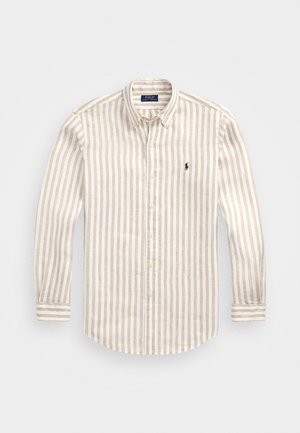 Beżowo-biała koszula z pionowymi paskami na całej długości rękawa, zapinana na guziki, z kołnierzykiem i małym granatowym logo Polo Ralph Lauren na lewej piersi.