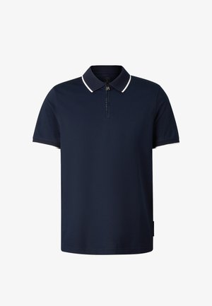 Granatowy polo z krótkim rękawem, z zamkiem błyskawicznym z przodu oraz kołnierzykiem i zakończeniami rękawów wykończonymi białą lamówką.