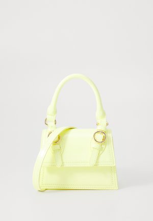Mini handbag in glossy neon yellow, featuring a structured design, short handle, adjustable strap, and gold hardware accents.