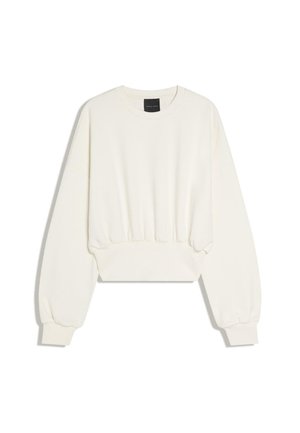 Felpa corta color crema con maniche lunghe a sbuffo e polsini a costine, scollo rotondo e vita arricciata.