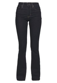 Jeans de algodón en denim azul oscuro con cintura alta, detalles de costura sutil y un corte recto. Sin desgastes ni embellishments visibles.