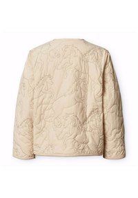 Beige quiltad jacka med ett präglat hästmönster, avslappnad passform och rund halsringning, tillverkad av ett mjukt, texturerat tyg.