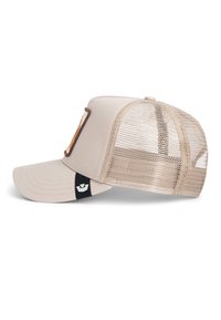 Light beige trucker cap with mesh back, curved brim, and a rectangular patch on the front panel with an orange design.