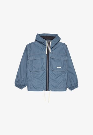 Modrá károvaná bunda s kapucňou, dvoma prednými vreckami, zapínaním na zips a elastickými manžetami. Má sťahovací lem a kontrastné lemy.