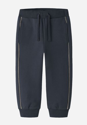 Pantalon de jogging bleu marine pour tout-petit avec taille élastique côtelée, cordon de serrage, poches latérales, bandes latérales beiges et poignets côtelés aux chevilles.