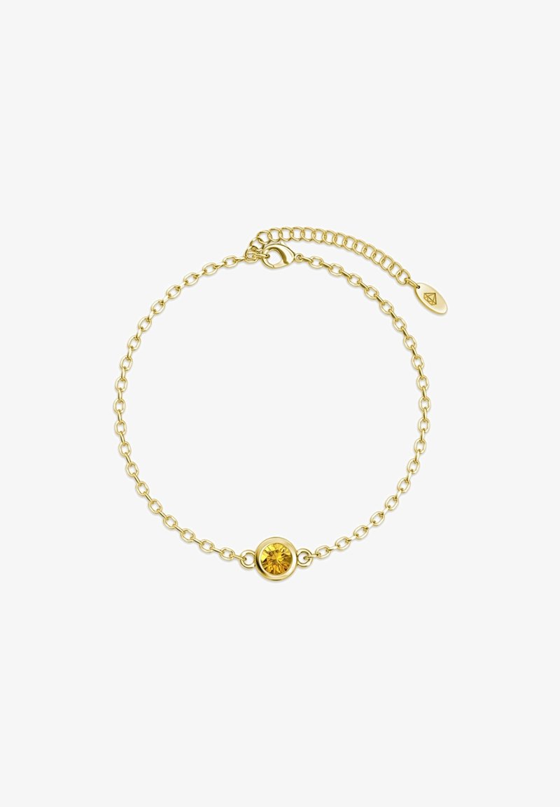 Gouden armband met een ronde gele edelsteen in het midden, met een verstelbare sluiting en een verfijnd schakelontwerp.