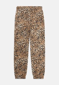 Joggebukser med leopardmønster i nyanser av brunt og svart, med elastisk midjebånd og smale ankler, med en myk stoffkvalitet.