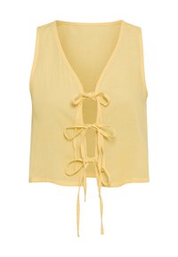 Κίτρινο crop top χωρίς μανίκια με V-λαιμόκοψη, διαθέτει δέσιμο μπροστά και ελαφρύ υφασμένο ύφασμα.