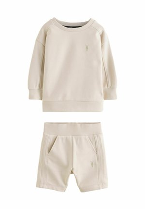 Beige sweatshirt en shorts set van een katoenmix. Kenmerken ribbelmanchetten en -band, met een klein logo detail op beide stukken.