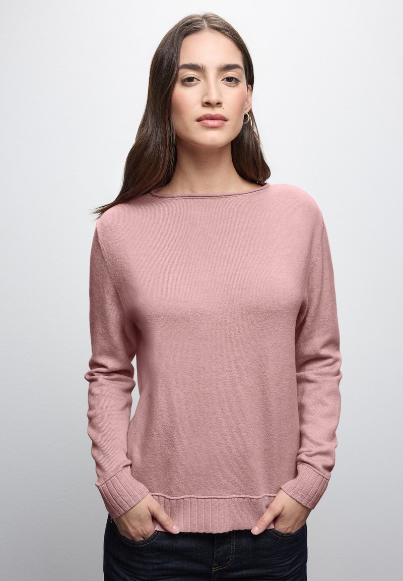 Helles rosa Strickpullover mit langen Ärmeln, gerippten Bündchen und einem Rundhalsausschnitt. Strukturierter Stoff und lässige Passform.