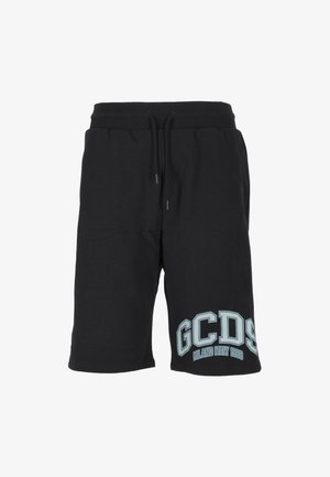 Pantalones cortos negros hasta la rodilla con cintura de cordón y gran logotipo "GCDS Milano Italy 1988" impreso cerca del dobladillo inferior en la pierna izquierda.