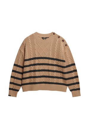 Beige gebreide trui met kabelpatronen en zwarte strepen. Heeft een ronde halslijn en zijknopen. Gelaagd, chunky stof.