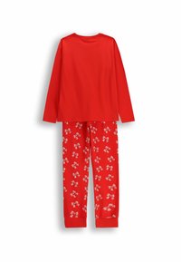Czerwona bluzka z długim rękawem i okrągłym dekoltem, w zestawie z czerwonymi spodniami w białe wzory w kokardki. Miękki bawełniany materiał, dopasowane mankiety w spodniach.