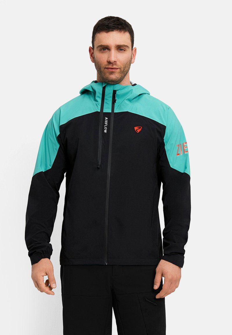 Man wearing a black and turquoise hooded jacket with "AIRFLOW" text on the zipper and logo on the chest and sleeve.